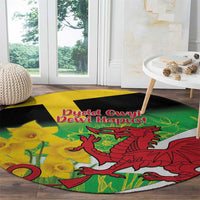 Round green rug with red dragon and yellow daffodils, black edge on floor