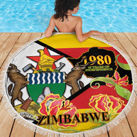 Round fringed beach blanket with Zimbabwe 1980 Independence artwork and flames