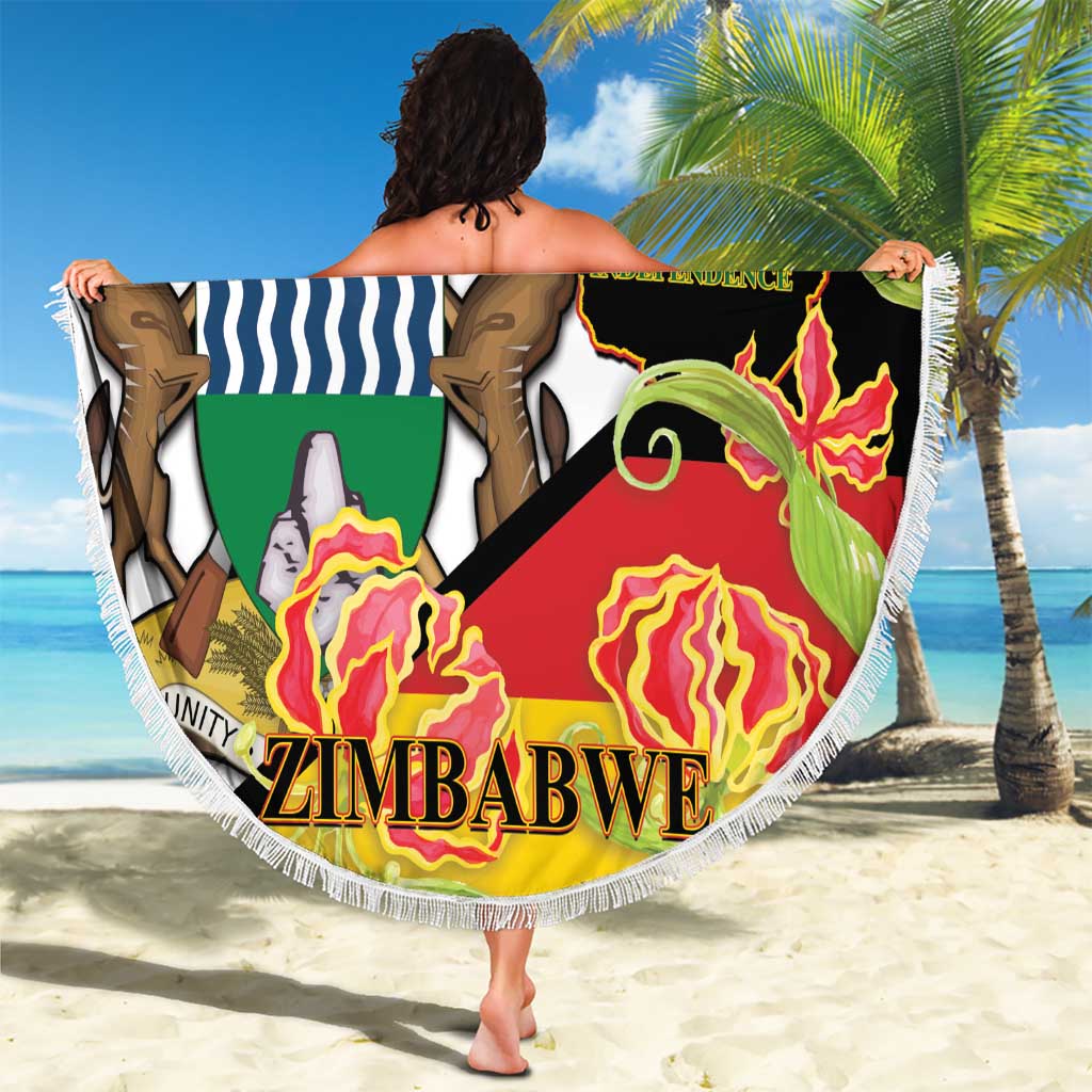 Round fringed beach blanket with Zimbabwe 1980 Independence graphic and ZIMBABWE text