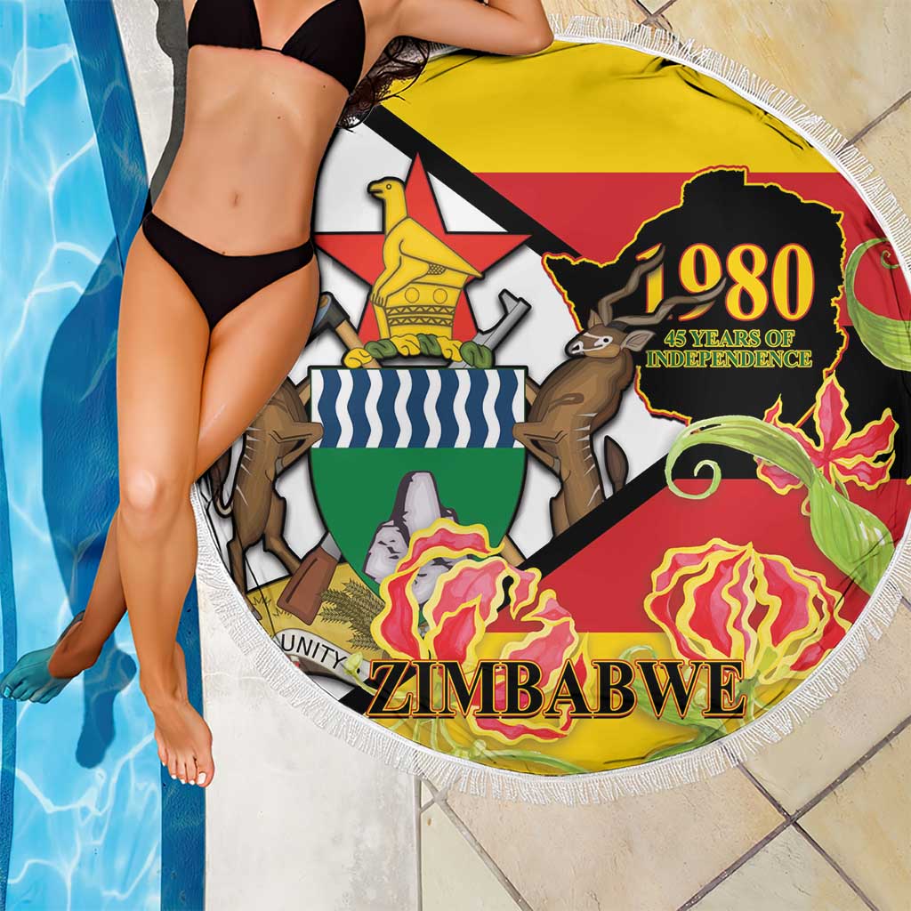 Round fringed beach blanket with Zimbabwe 1980 Independence graphic and ZIMBABWE lettering