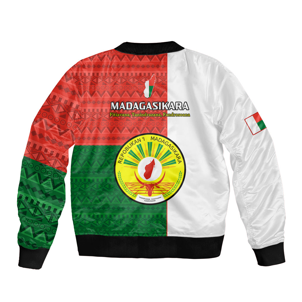Bomber jacket with red/green geometric back print, circular emblem, and white sleeves