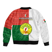 Bomber jacket with red/green geometric back print, circular emblem, and white sleeves