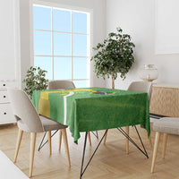 Green Brazil-themed tablecloth covering dining table with flag map artwork