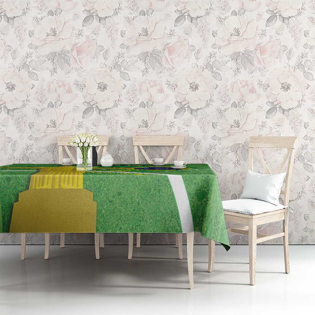 Green tablecloth on dining table with Brazil flag map design and Christ theme