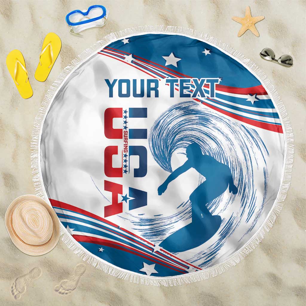 Round beach blanket with blue, white, red USA surfing graphic and fringe edge, text