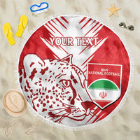 Red-and-white round beach blanket with lion graphic, Iran football shield, and fringe