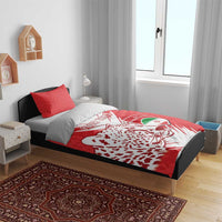 Red football bedding set on bed with duvet cover showing lion head, “YOUR TEXT,” and crest