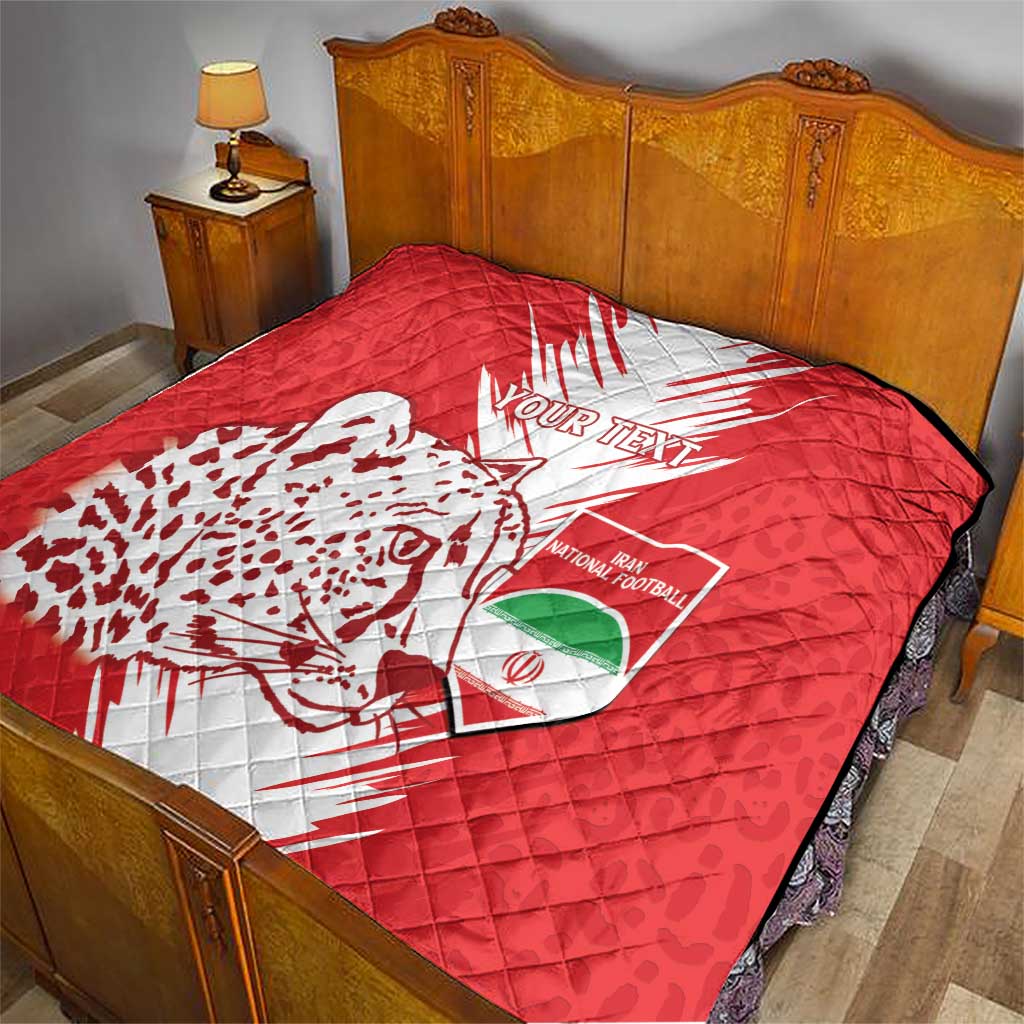 Red football quilt on bed with white lightning design, leopard silhouette, and "Your Text"