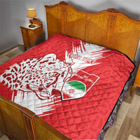 Red football quilt on bed with white lightning design, leopard silhouette, and "Your Text"