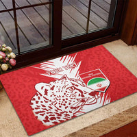 Red rubber doormat with leopard graphic and football shield on entry floor