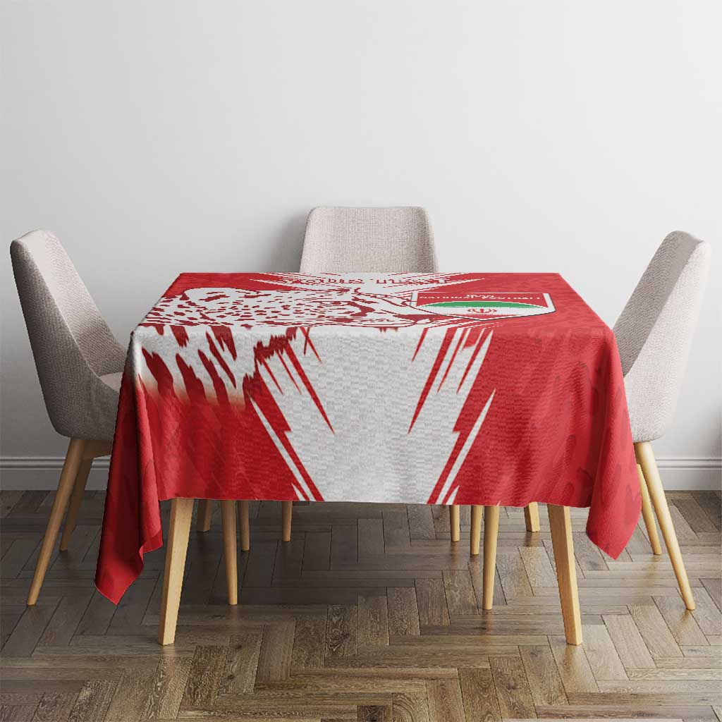 Red football tablecloth with white lightning and leopard-style spots