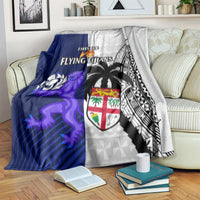 Rugby blanket with blue lion graphic, white geometric textures, black tribal pattern and crest