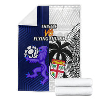 Rugby blanket with blue, white, and black panels, crest, and THISTLE / FLYING FIJIANS text