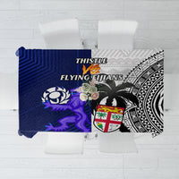 Blue and black patterned rugby tablecloth with thistle graphic and abstract tapa motifs