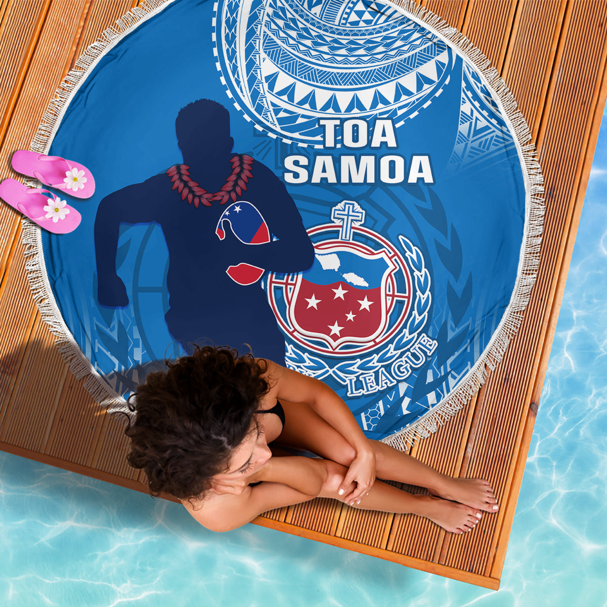 Blue circular beach blanket with fringe, Toa Samoa text, crest and rugby player silhouette