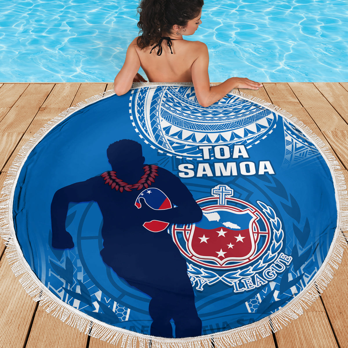 Blue circular beach blanket with fringe, Toa Samoa rugby crest and player silhouette graphic