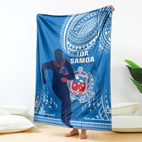 Blue rugby blanket with white Polynesian patterns and Tofa Samoa logo in the center