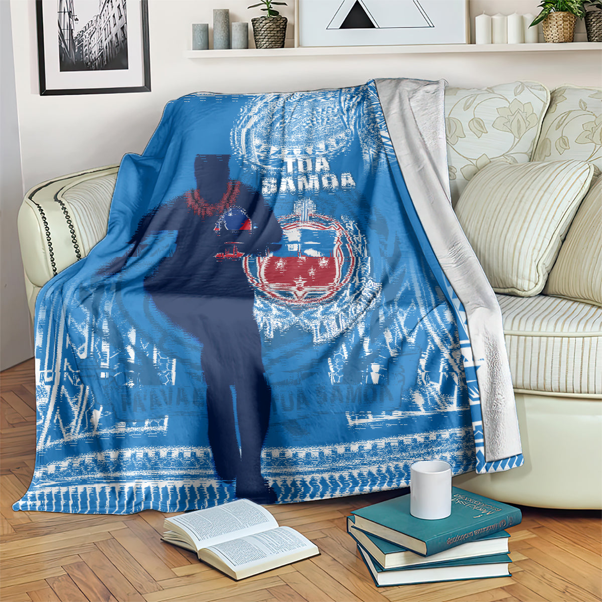 Blue rugby blanket over an armchair, showing player silhouette and white patterned border