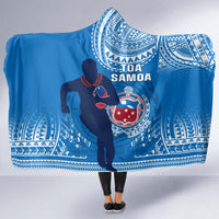 Blue hooded blanket with Samoa emblem, Toa Samoa lettering, and tribal border