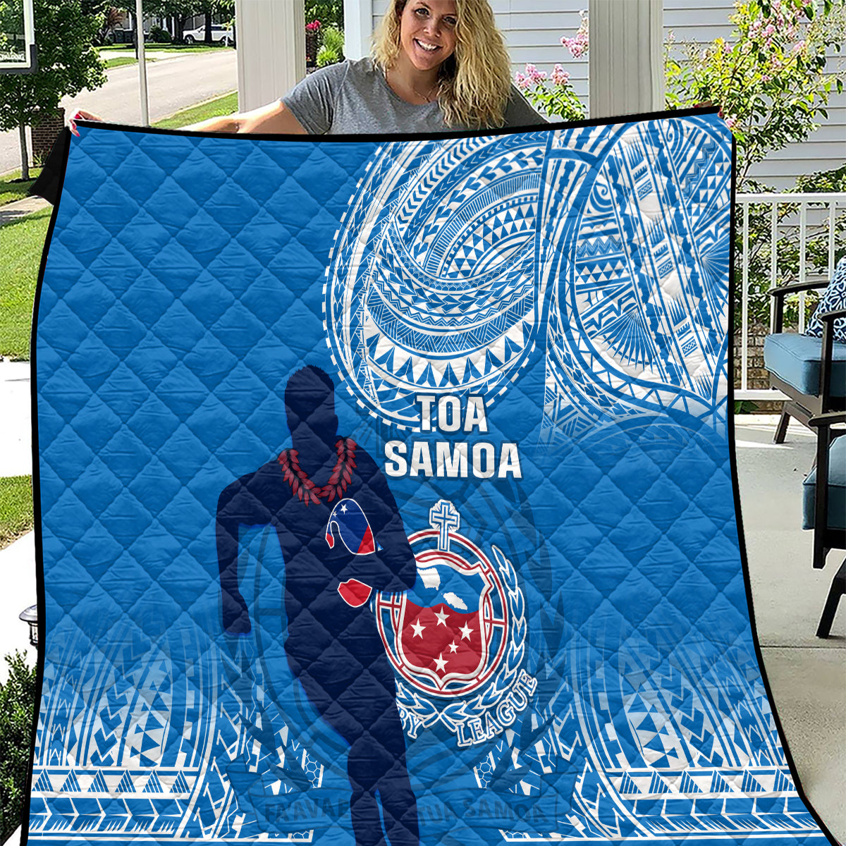 Blue Samoa rugby quilt with dark silhouette and circular white pattern, quilted bedding