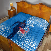 Blue Samoa rugby quilt on bed with quilted texture and central emblem graphic