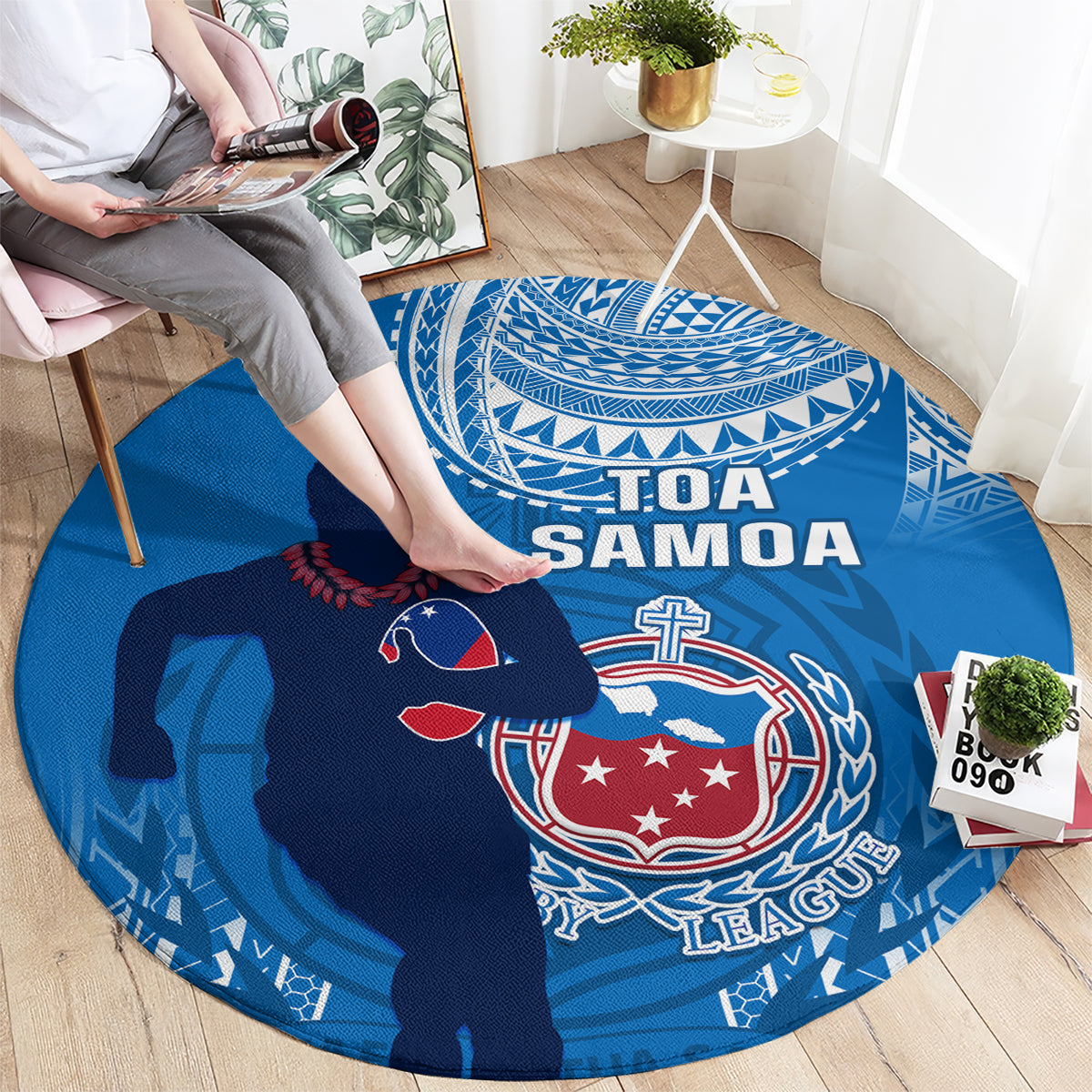 Blue round rugby carpet with Toa Samoa text and rugby player graphic in foreground