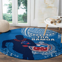 Blue round rugby carpet with Toa Samoa lettering and rugby crest design