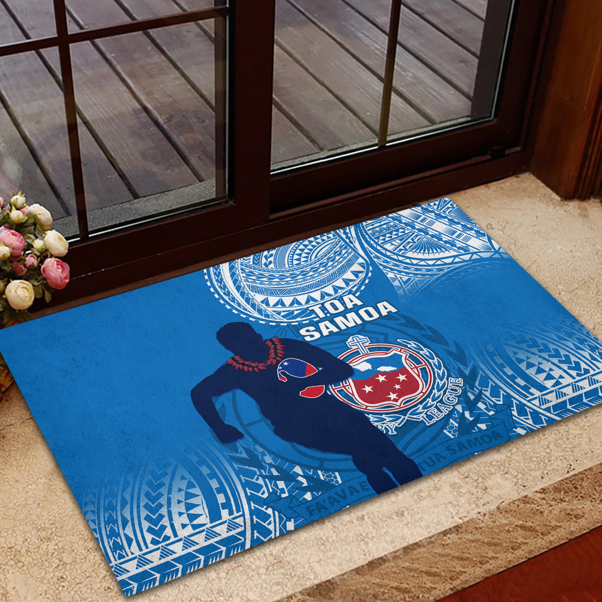 Blue rugby doormat with Toa Samoa text, shield crest, and white patterned border