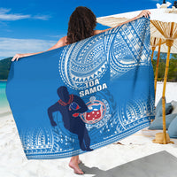 Blue rugby sarong with white patterned border and Toa Samoa crest logo