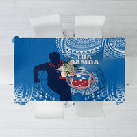 Blue rugby tablecloth with white geometric border and printed rugby player graphic