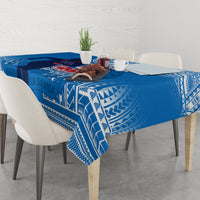 Blue rugby tablecloth with white geometric border, set with tableware