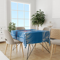 Blue rugby tablecloth with white tribal print on a dining table with chairs