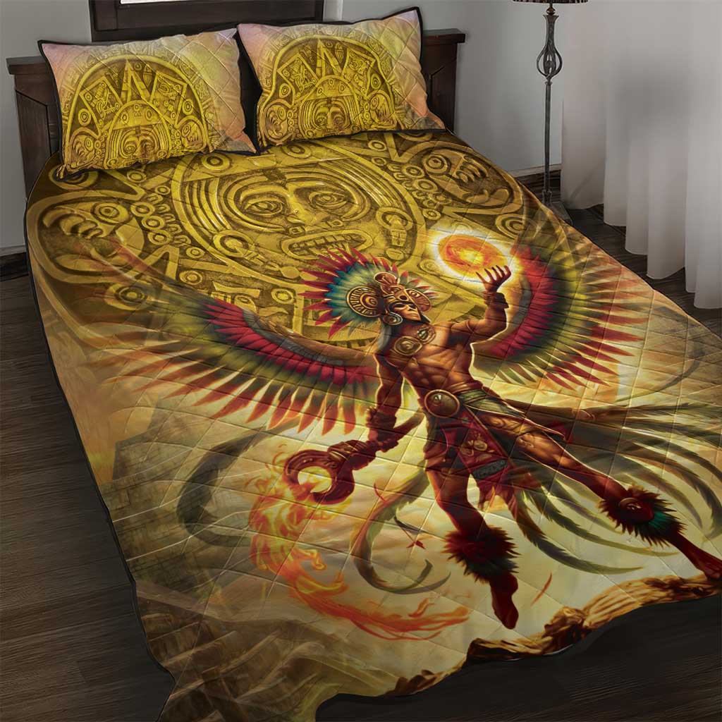 Gold quilt bed set with two patterned pillows and central sun warrior artwork