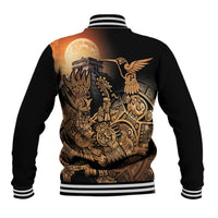 Black baseball jacket back view with gold/orange Aztec collage and hummingbird, striped ribbed hem