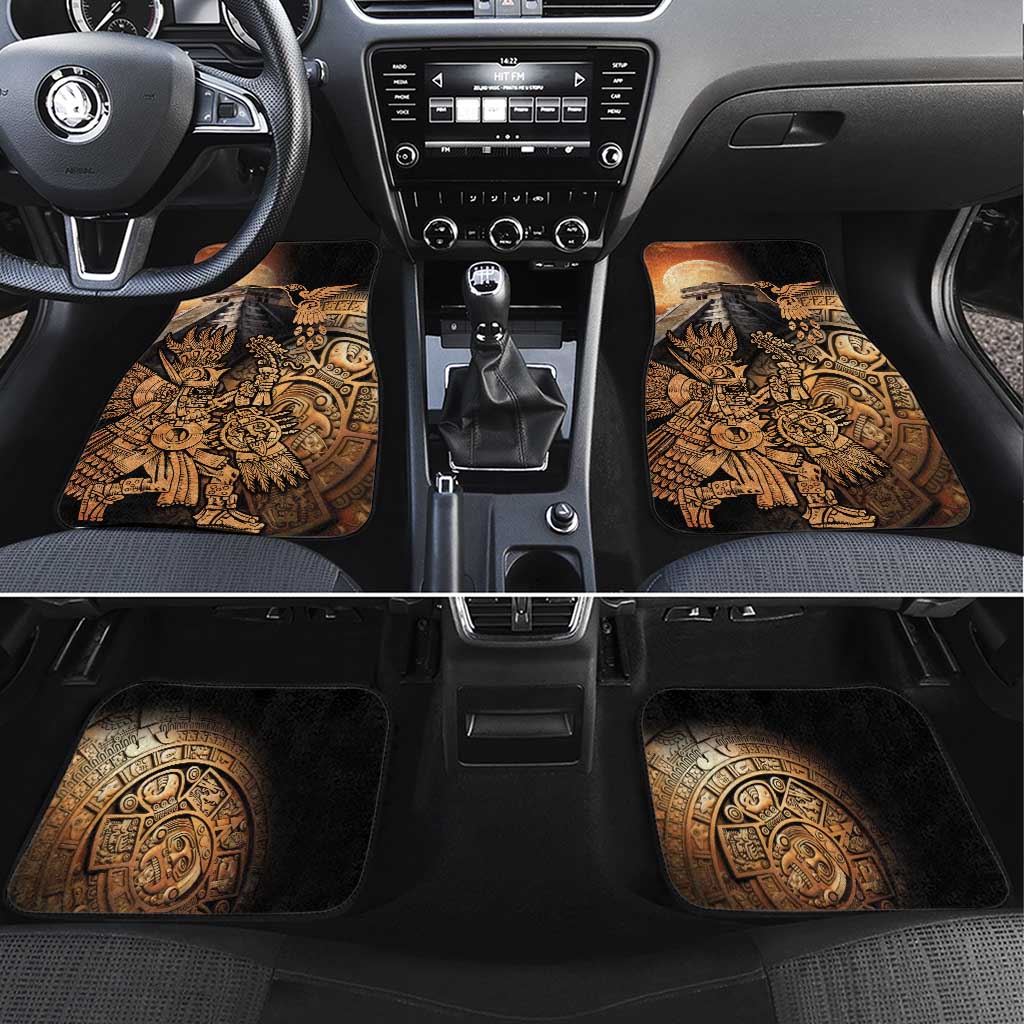 Black car floor mat pair with gold Aztec warrior and hummingbird artwork, front row view