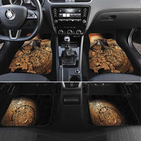 Black car floor mat pair with gold Aztec warrior and hummingbird artwork, front row view