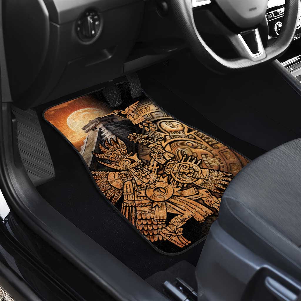 Black car floor mat with gold Aztec warrior and hummingbird design, seat corner