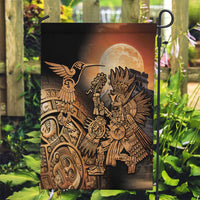 Black garden flag on a pole with Aztec hummingbird and warrior under full moon