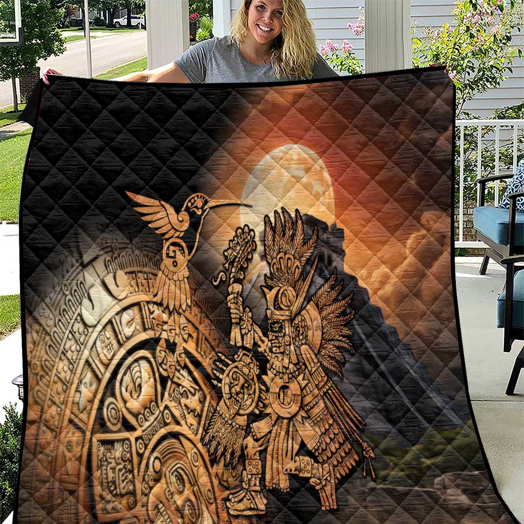 Black quilted blanket with Aztec warrior and feathered bird motif, golden printed design
