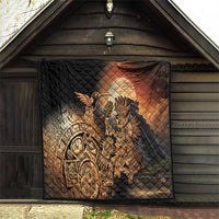 Black quilted outdoor wall blanket featuring Aztec warrior and feathered bird artwork in gold