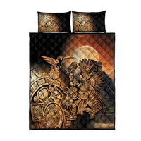 Quilt bed set shown flat: black quilt with gold Aztec bird and warrior motif, 2 matching pillows
