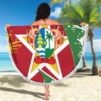 Round beach blanket held up with Suriname flag emblem and white fringe edge