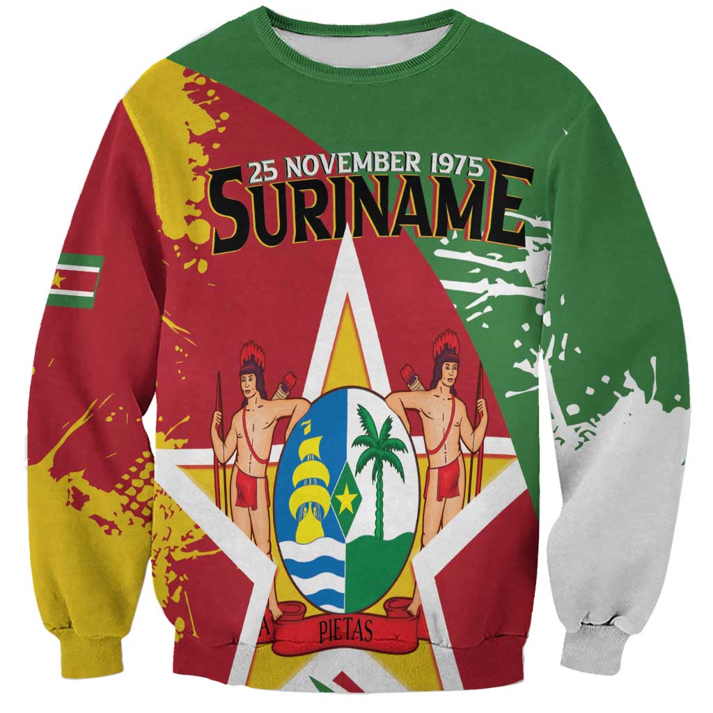 Green sweatshirt with Suriname flag-style coat of arms graphic, long sleeves