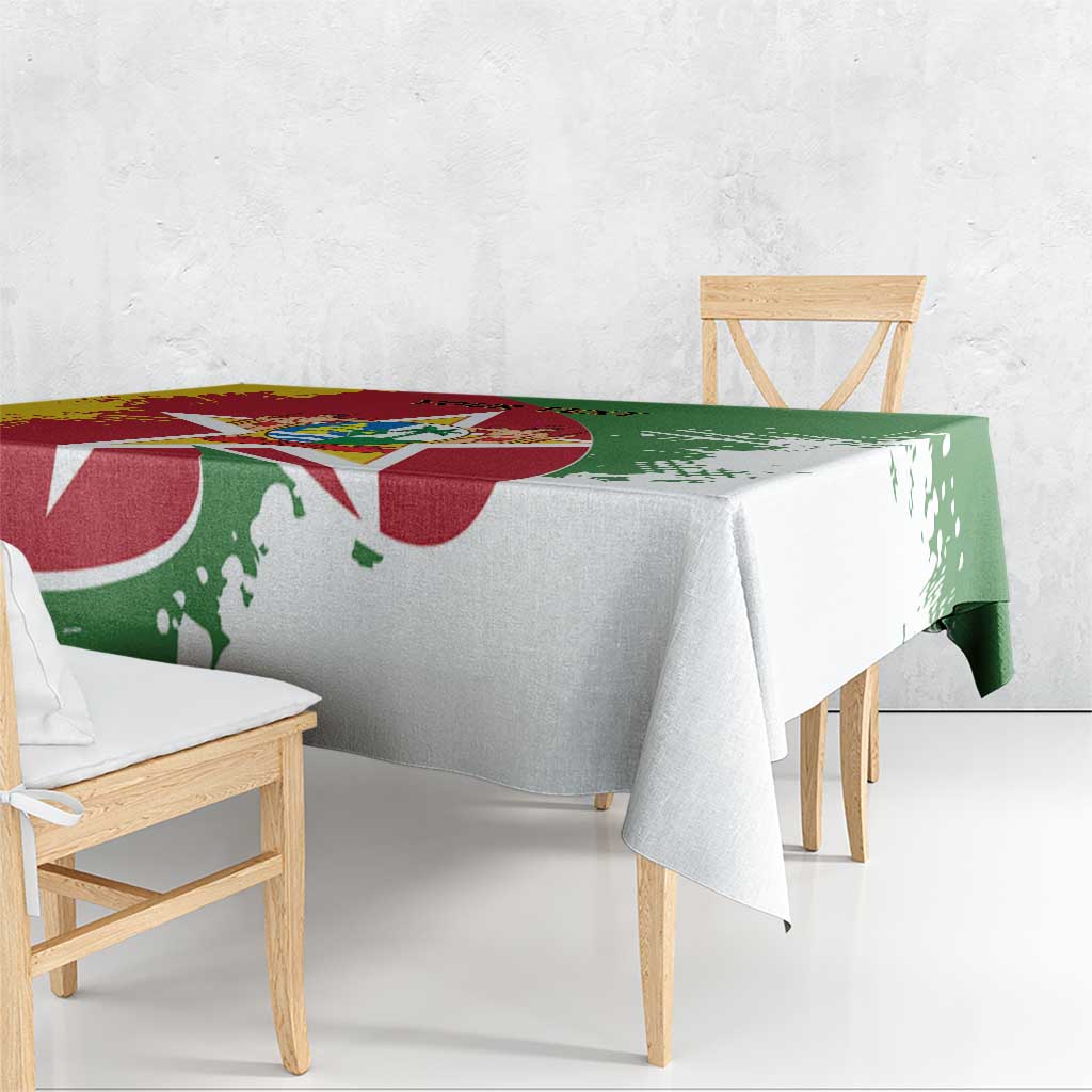 Suriname flag-style tablecloth with red-and-green print, draped over bench and table