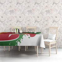 Suriname flag-style tablecloth on dining table with flower chairs, red green and white print
