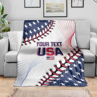 Patriotic baseball USA blanket draped on gray couch, white with blue stars and red stripes