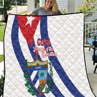 White Cuba-themed quilt blanket with red and blue diagonal flag stripes and crest