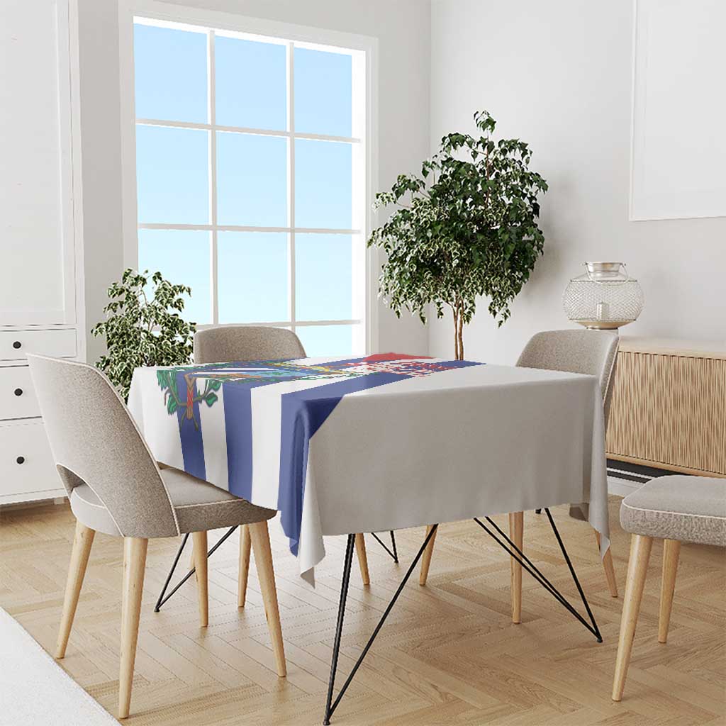 White tablecloth with blue-and-white stripes and Cuba-themed emblem on dining table