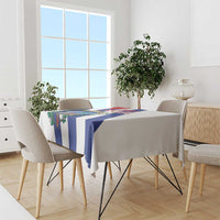 White tablecloth with blue-and-white stripes and Cuba-themed emblem on dining table