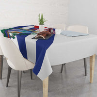 White tablecloth with blue stripes and Cuban emblem, draped over dining table
